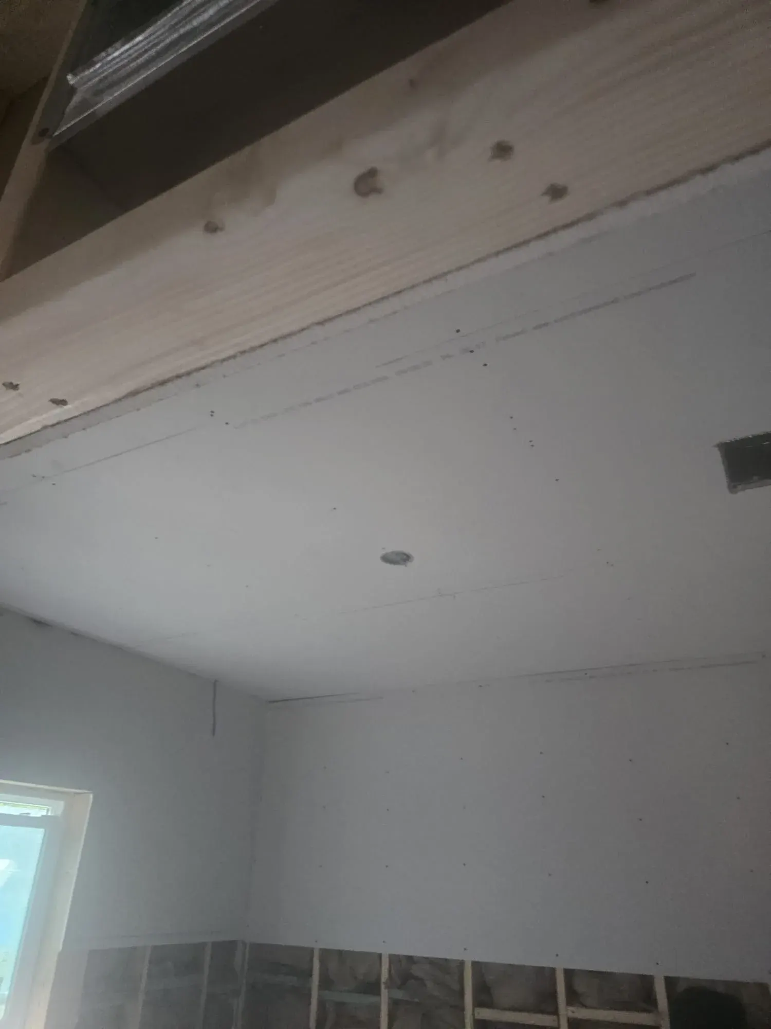 New drywall hung on a ceiling, drywall installation for Cape Coral renovations