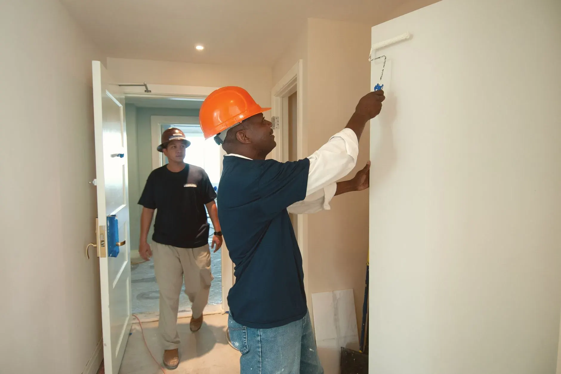Painter rolling a wall during an interior painting job in Lehigh Acres